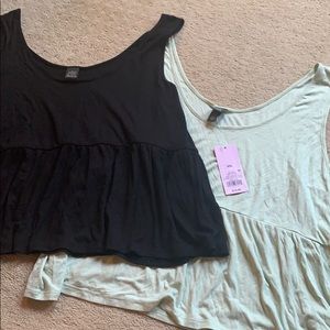 Two crop peplum tanks